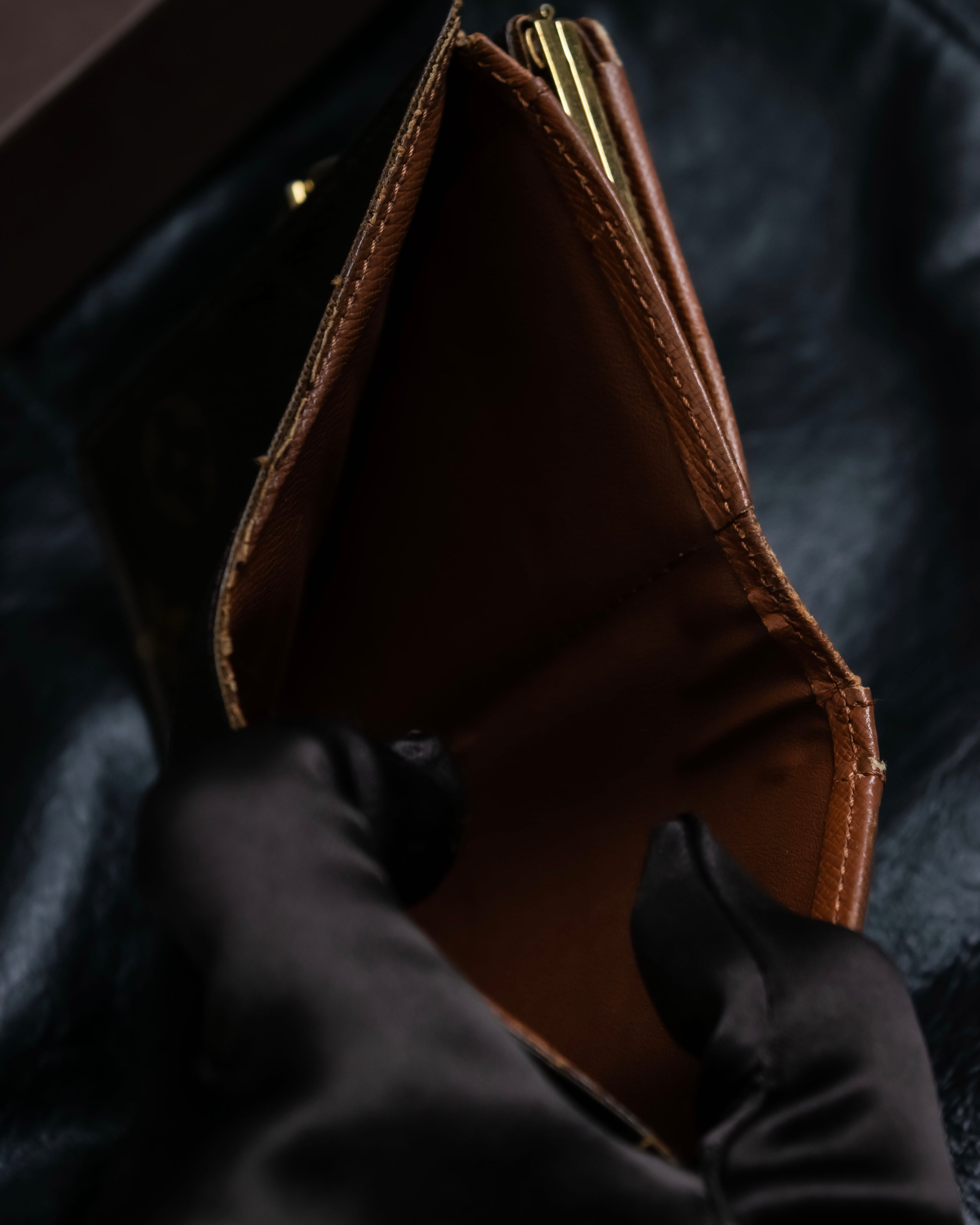 “Louis Vuitton” gold attachment designed monogram wallet