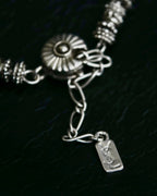 "Yves Saint Laurent"
Different sized beads silver necklace