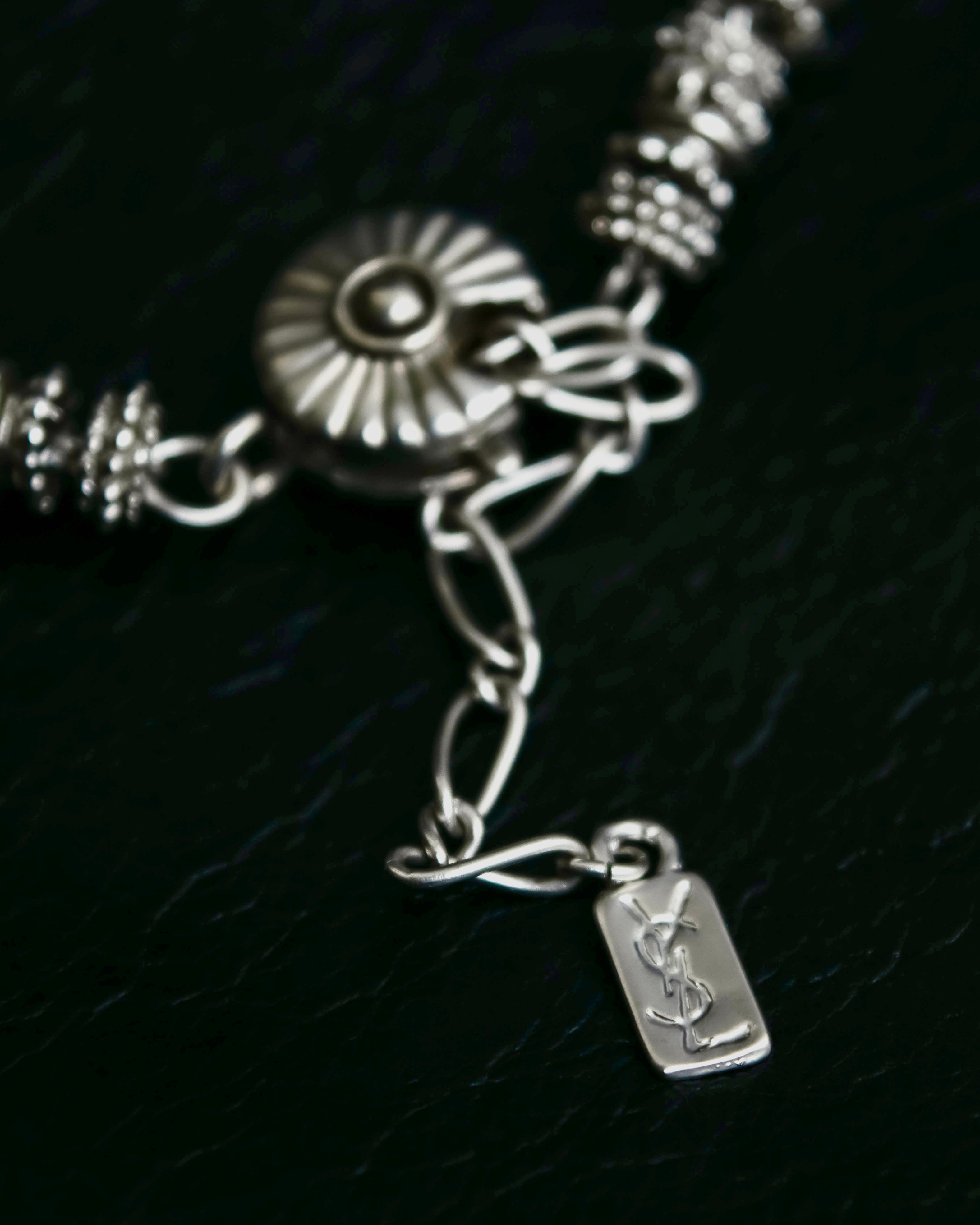 "Yves Saint Laurent"
Different sized beads silver necklace