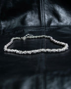 "Yves Saint Laurent"
Different sized beads silver necklace