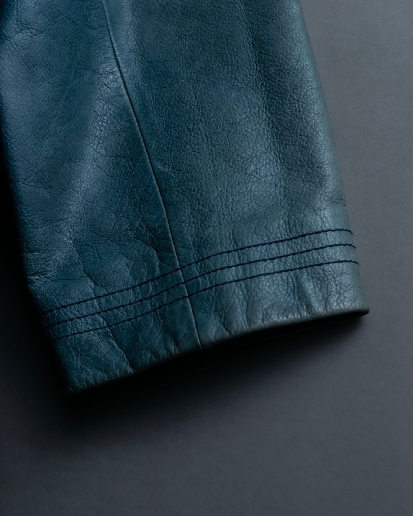 "COACH" light blue faded leather coat