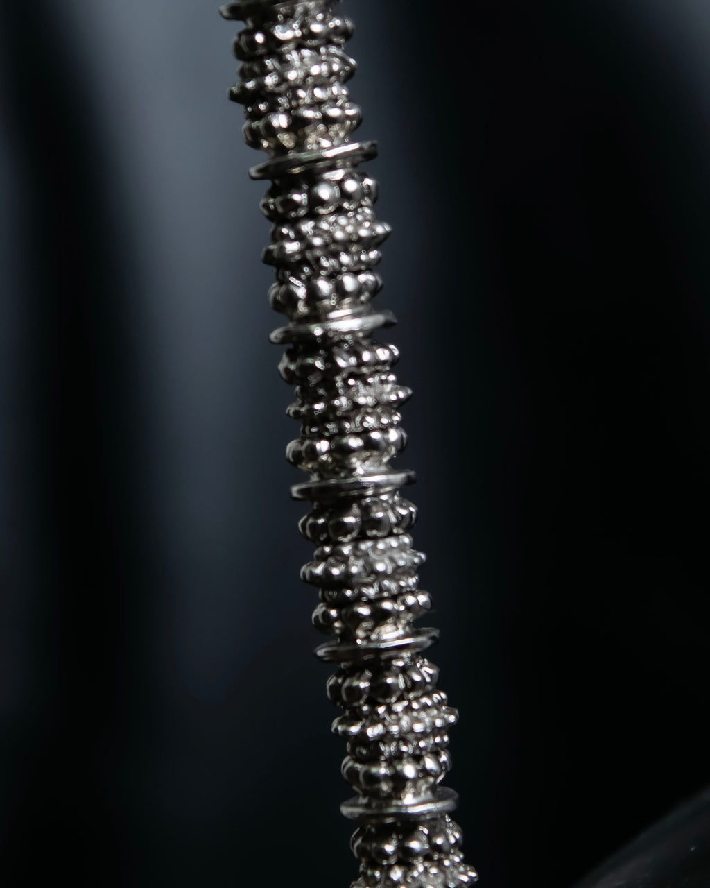 "Yves Saint Laurent"
Different sized beads silver necklace