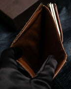 “Louis Vuitton” gold attachment designed monogram wallet