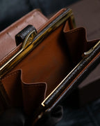 “Louis Vuitton” gold attachment designed monogram wallet
