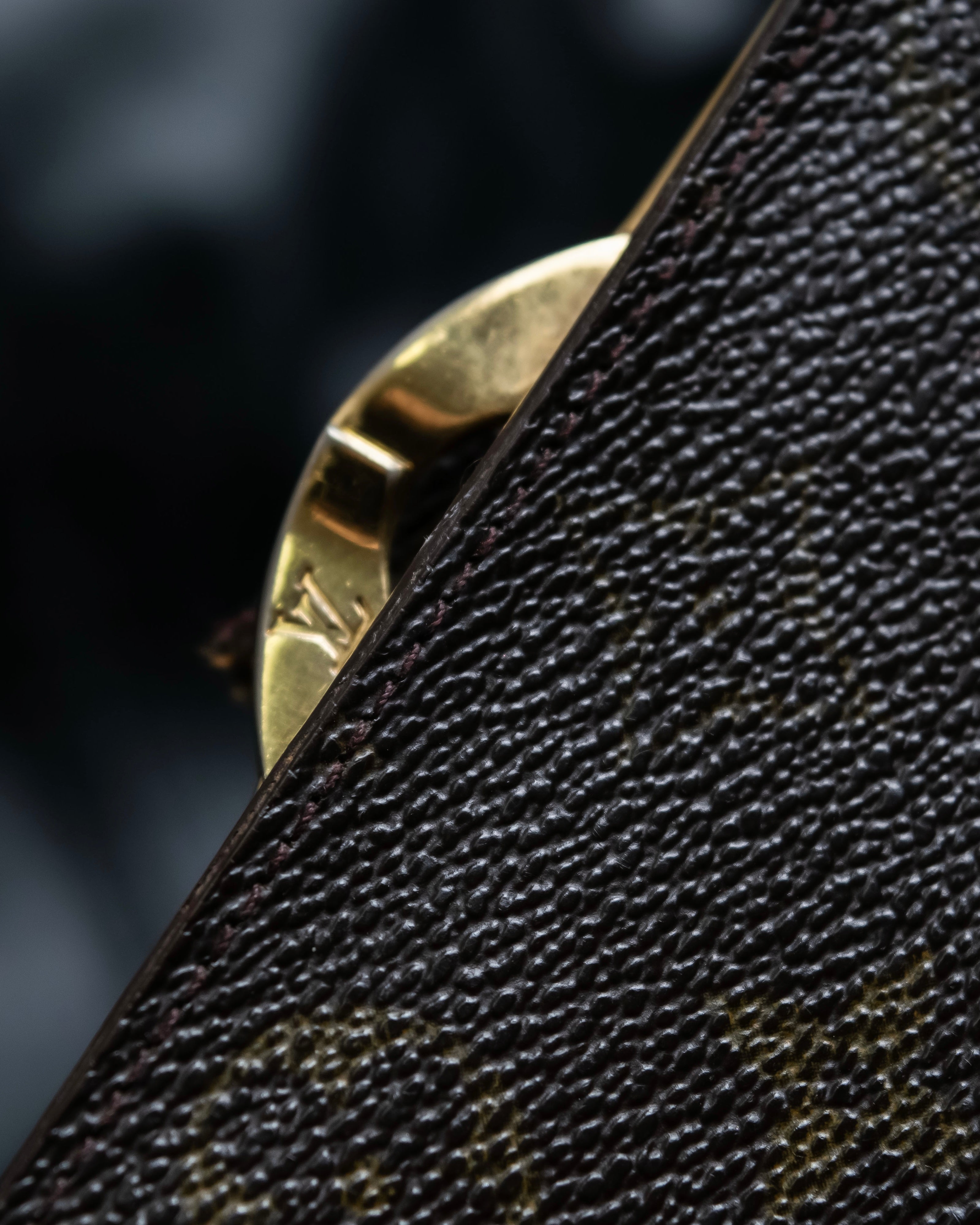 “Louis Vuitton” gold attachment designed monogram wallet