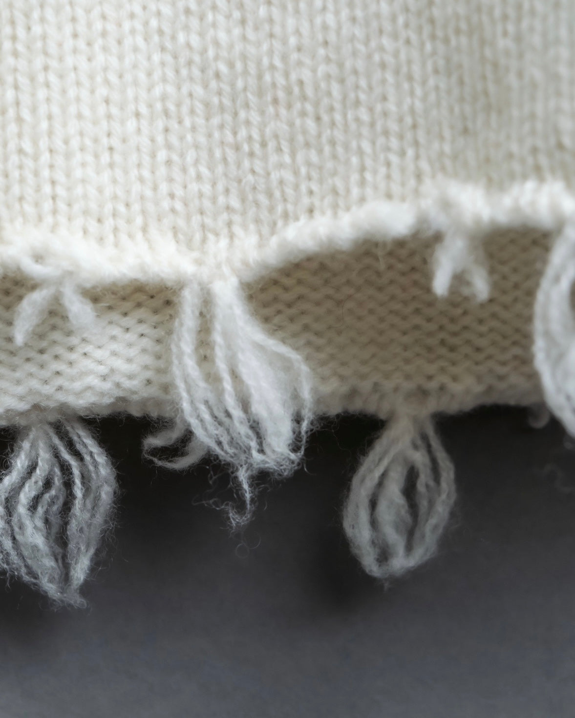 Distressed long sleeve knit