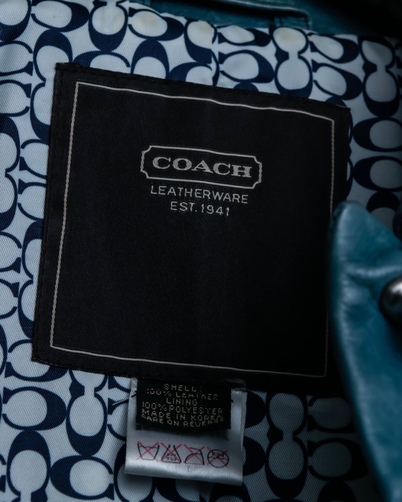 "COACH" light blue faded leather coat