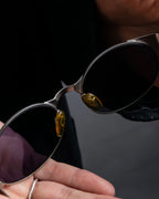 “CHANEL”  metal plate flame oval sunglasses