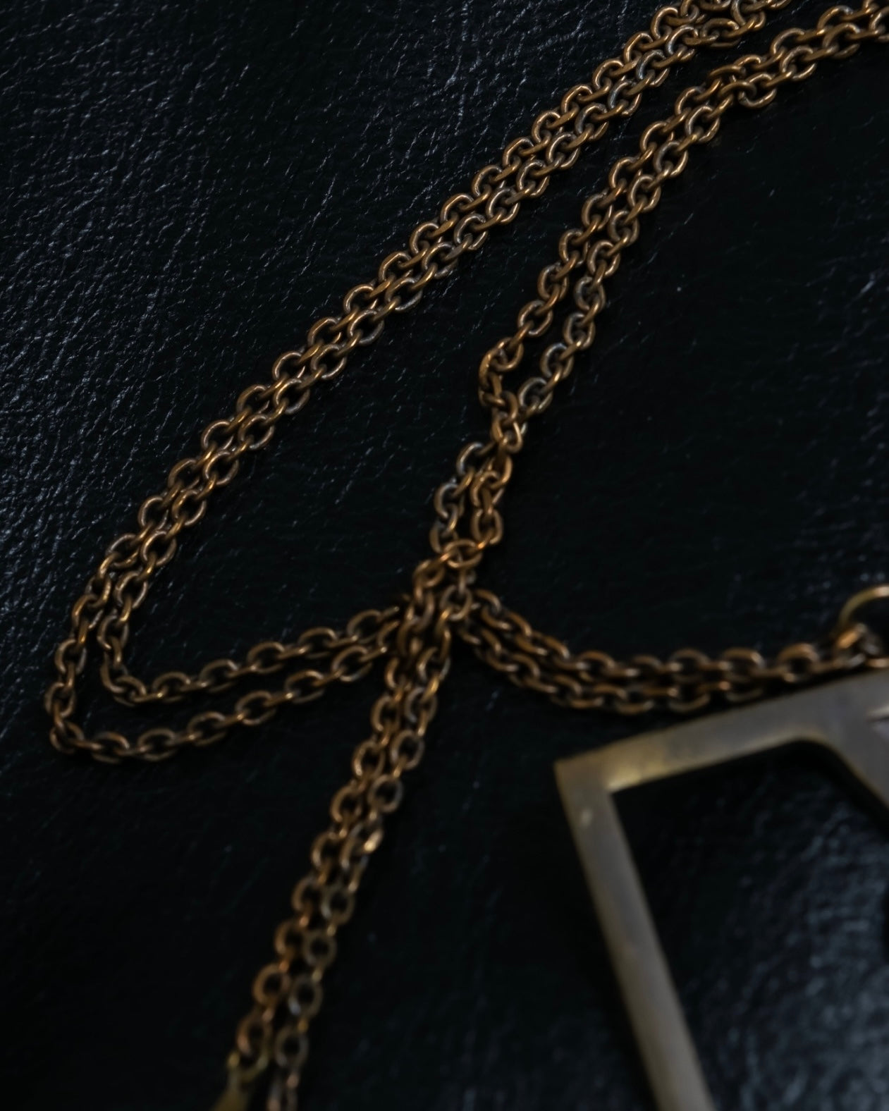 "Yves Saint Laurent" frame design logo motif necklace