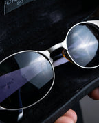 “CHANEL”  metal plate flame oval sunglasses