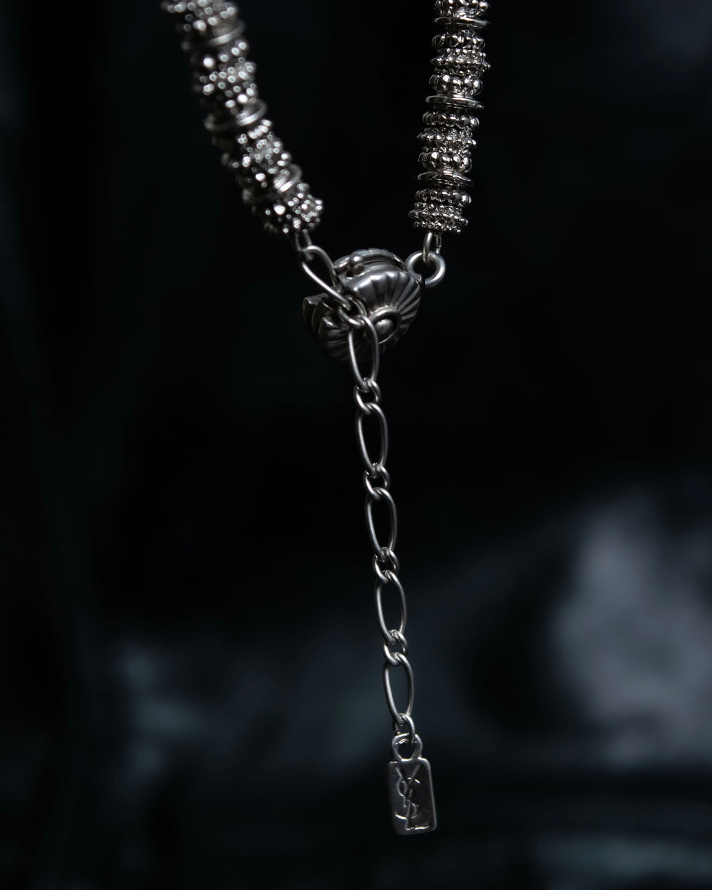"Yves Saint Laurent"
Different sized beads silver necklace