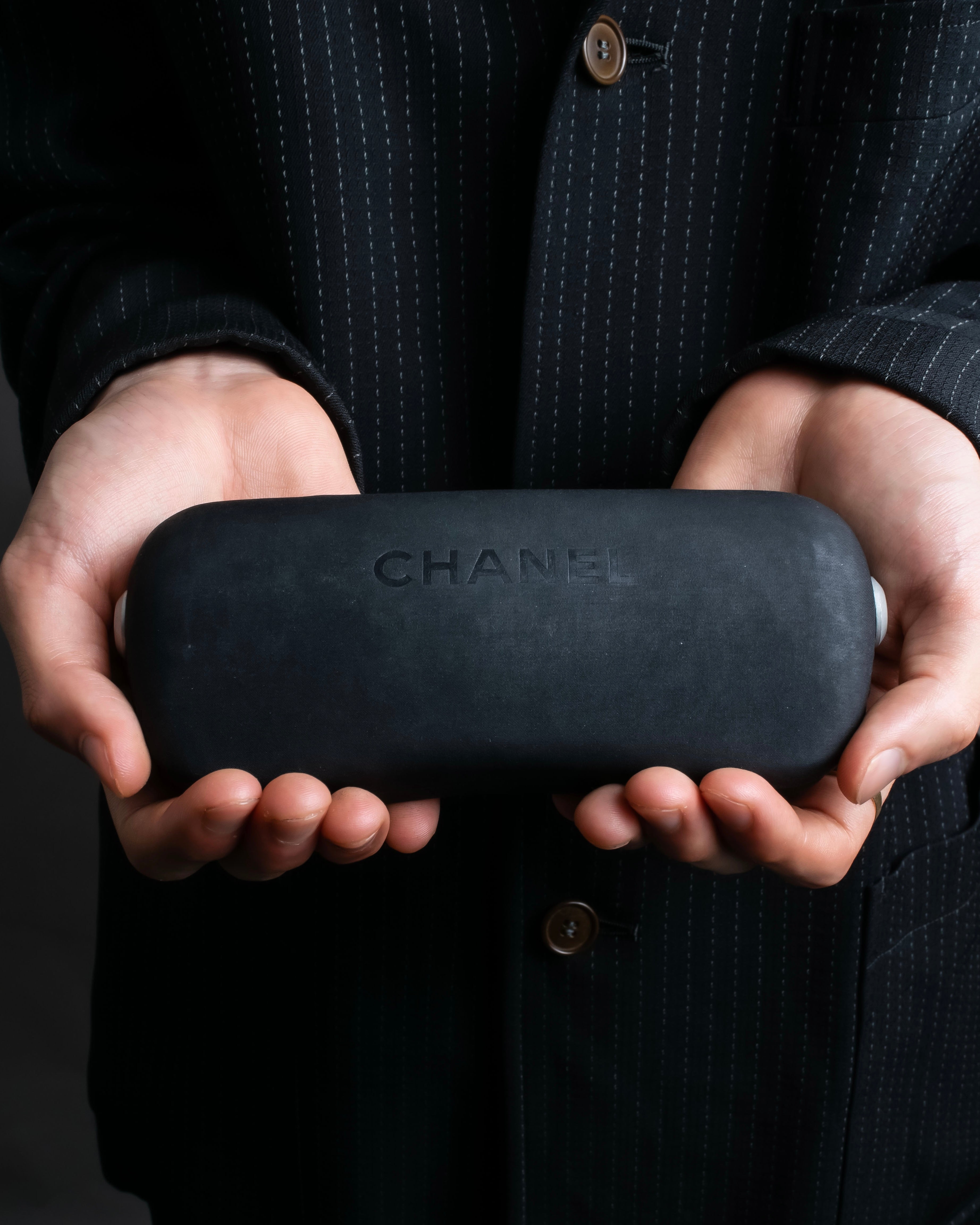 “CHANEL”  metal plate flame oval sunglasses