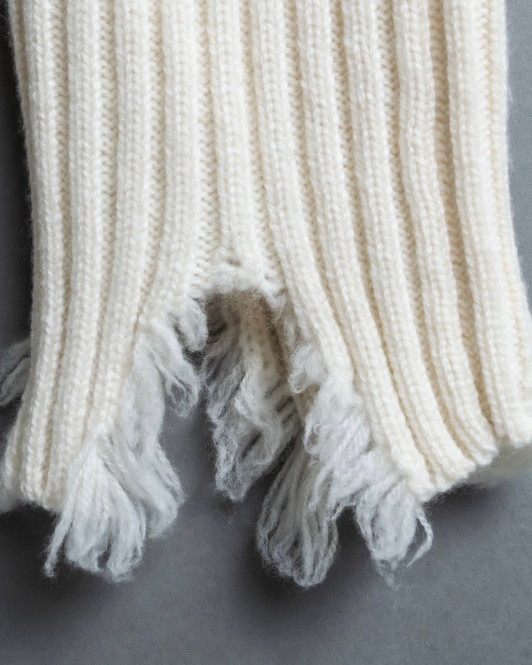 Distressed long sleeve knit