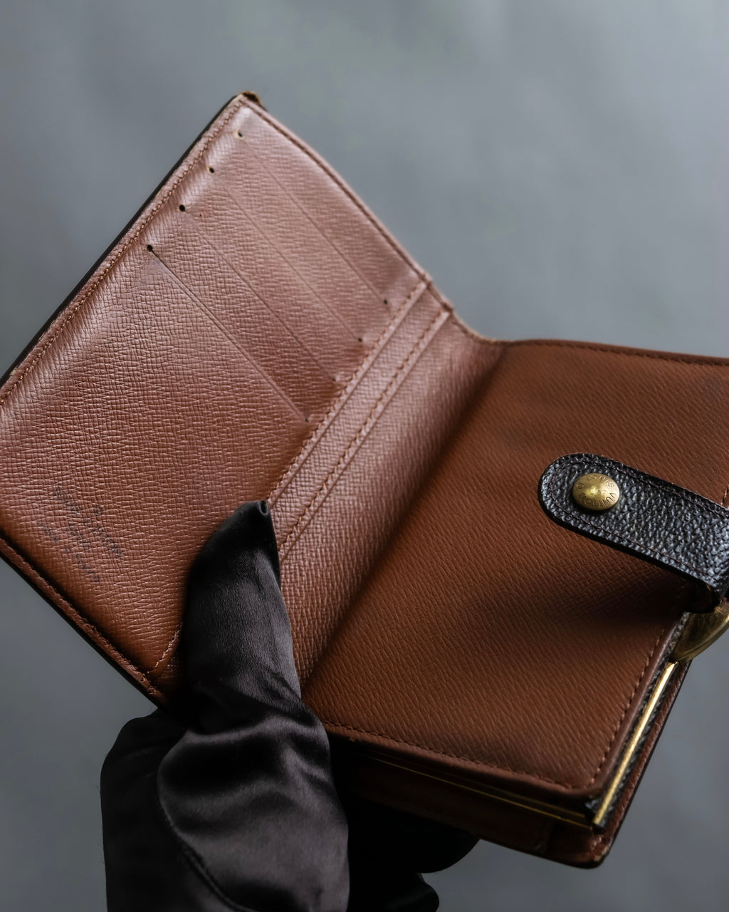 “Louis Vuitton” gold attachment designed monogram wallet