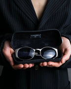 “CHANEL”  metal plate flame oval sunglasses