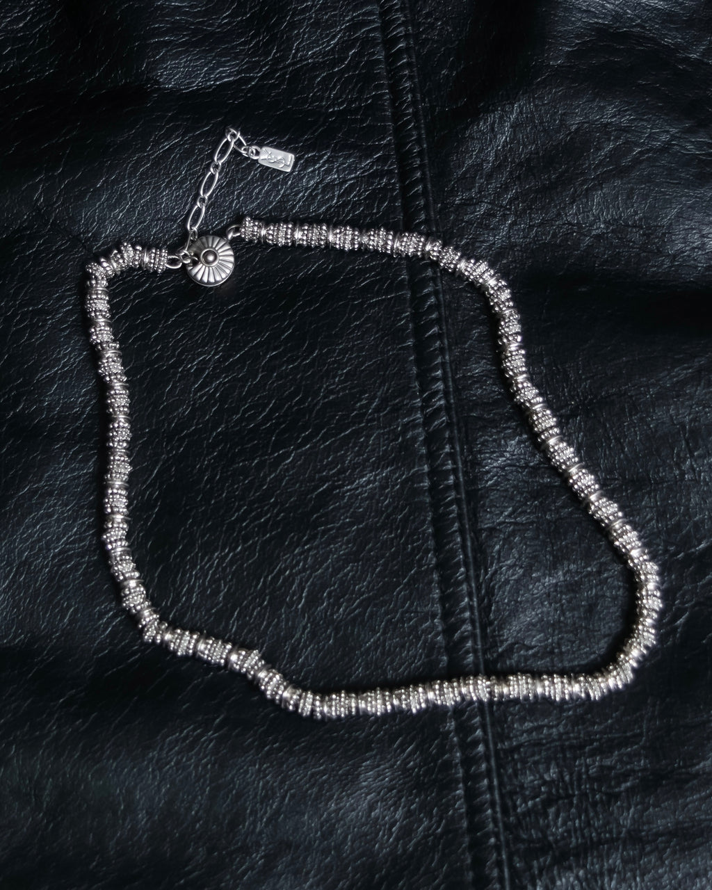 "Yves Saint Laurent"
Different sized beads silver necklace